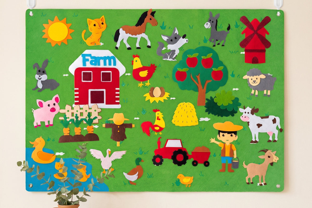 A green felt farm story board on a cream background, with a felt barn, farm animals, a tractor, a windmill, an apple tree and a farmer pressed onto it.
