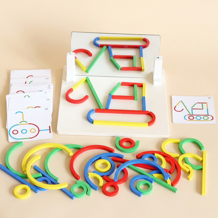 Building sticks version: coloured wooden sticks, arcs and rings arranged on the mirror base beside the pattern cards
