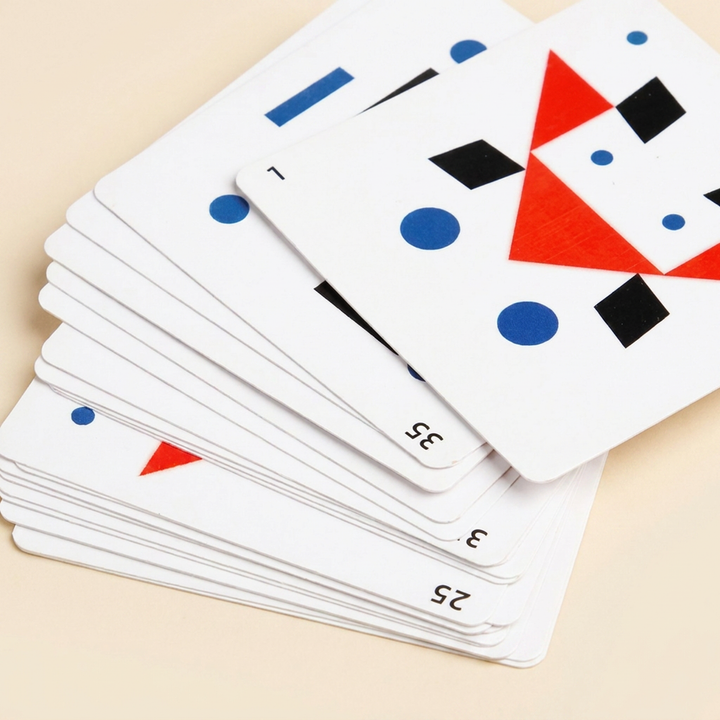 Close-up of the numbered double-sided pattern cards fanned out