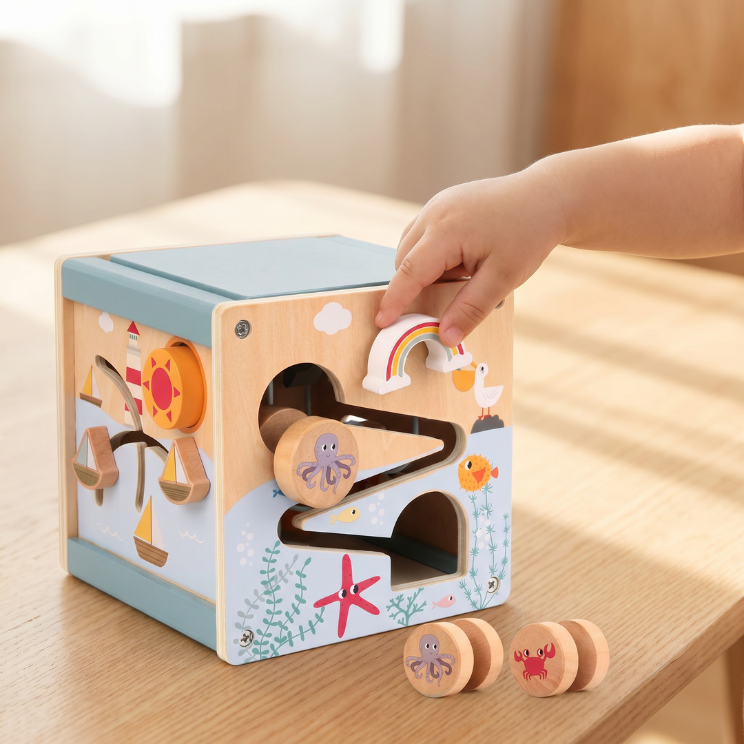 Wooden 5-in-1 Activity Cube for Toddlers — a child playing with it