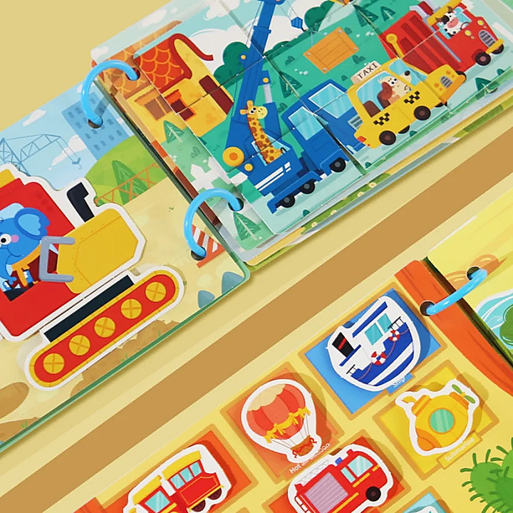 Close-up of the busy book vehicle pages with their cartoon picture cards on the binder rings