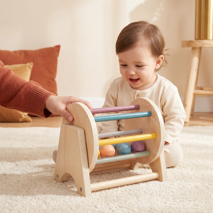 A parent and child playing with the wooden spinning drum.