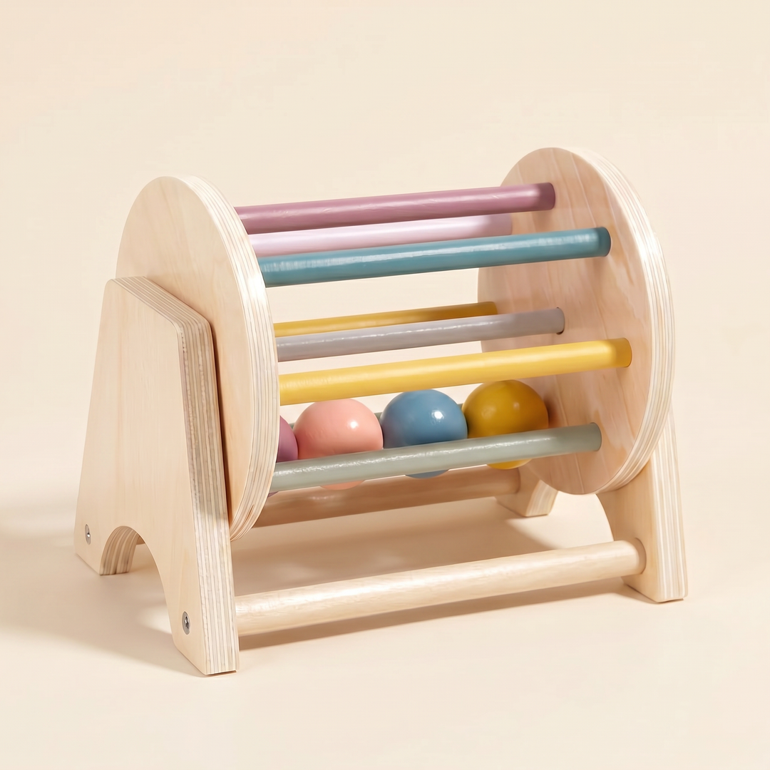 Wooden spinning drum at a three-quarter angle on warm cream.