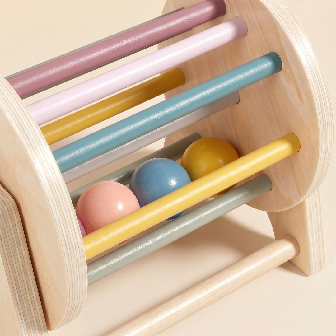 Close-up of the spinning drum pastel rods and loose wooden balls.