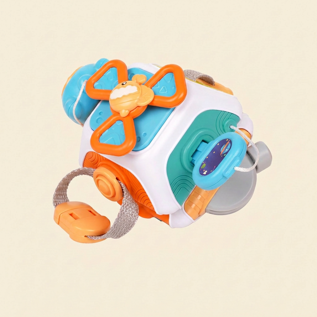 10-in-1 plastic sensory busy ball on warm cream - steering wheel, butterfly spinner, button and wrist strap