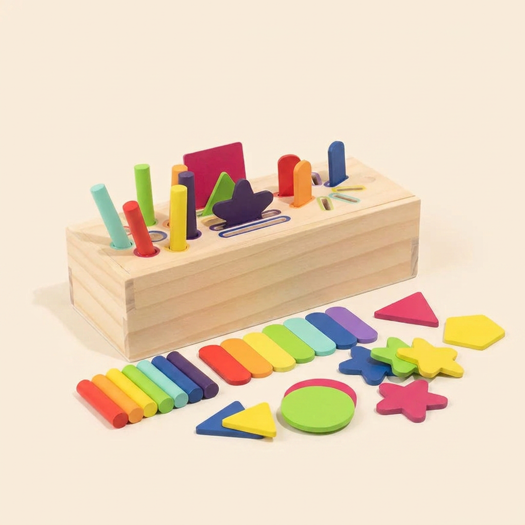 Wooden three-in-one sorting box on warm cream - natural-wood box with slotted lid and rainbow pegs, sticks and shape tiles