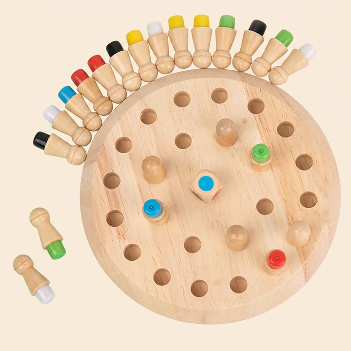 Wooden color memory game on warm cream - round wood board, red, yellow, blue, green, white and black pegs and a color die
