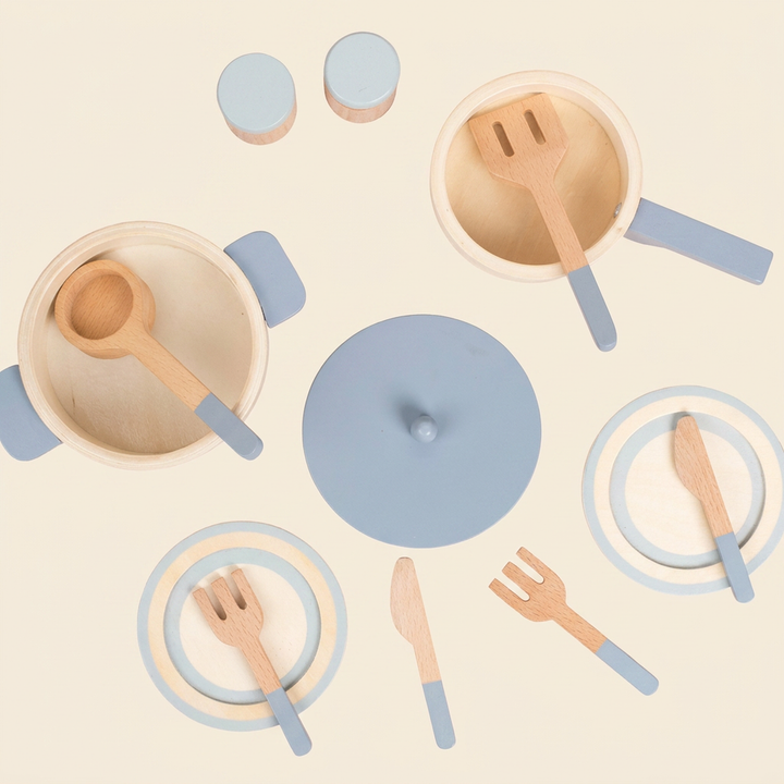 Wooden play kitchen cookware and dining set on warm cream - dusty-blue pot, saucepan, ladle, plates and cutlery