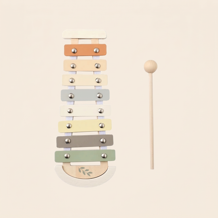 Wooden baby xylophone on warm cream - beechwood frame with eight pastel tuned bars and a wooden mallet