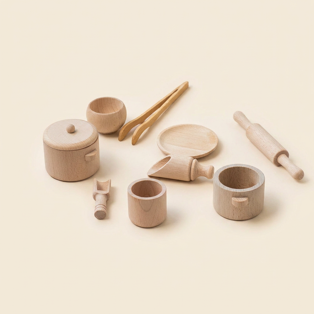 Nine-piece wooden tea and kitchen play set on warm cream - lidded pot, cups, saucer, rolling pin, dipper and scoops