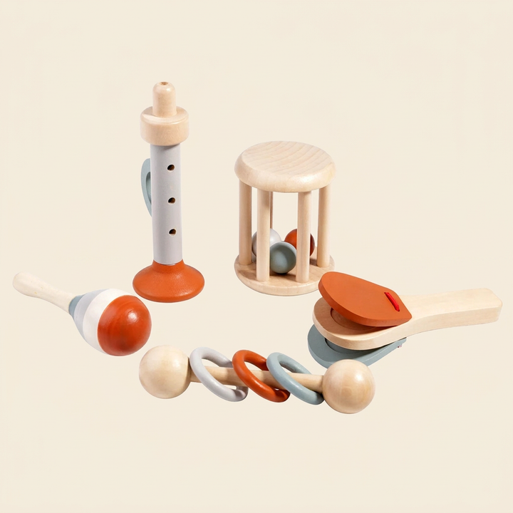 5-piece wooden baby musical instrument set on warm cream - horn, roller drum, clapper, maraca and ring rattle