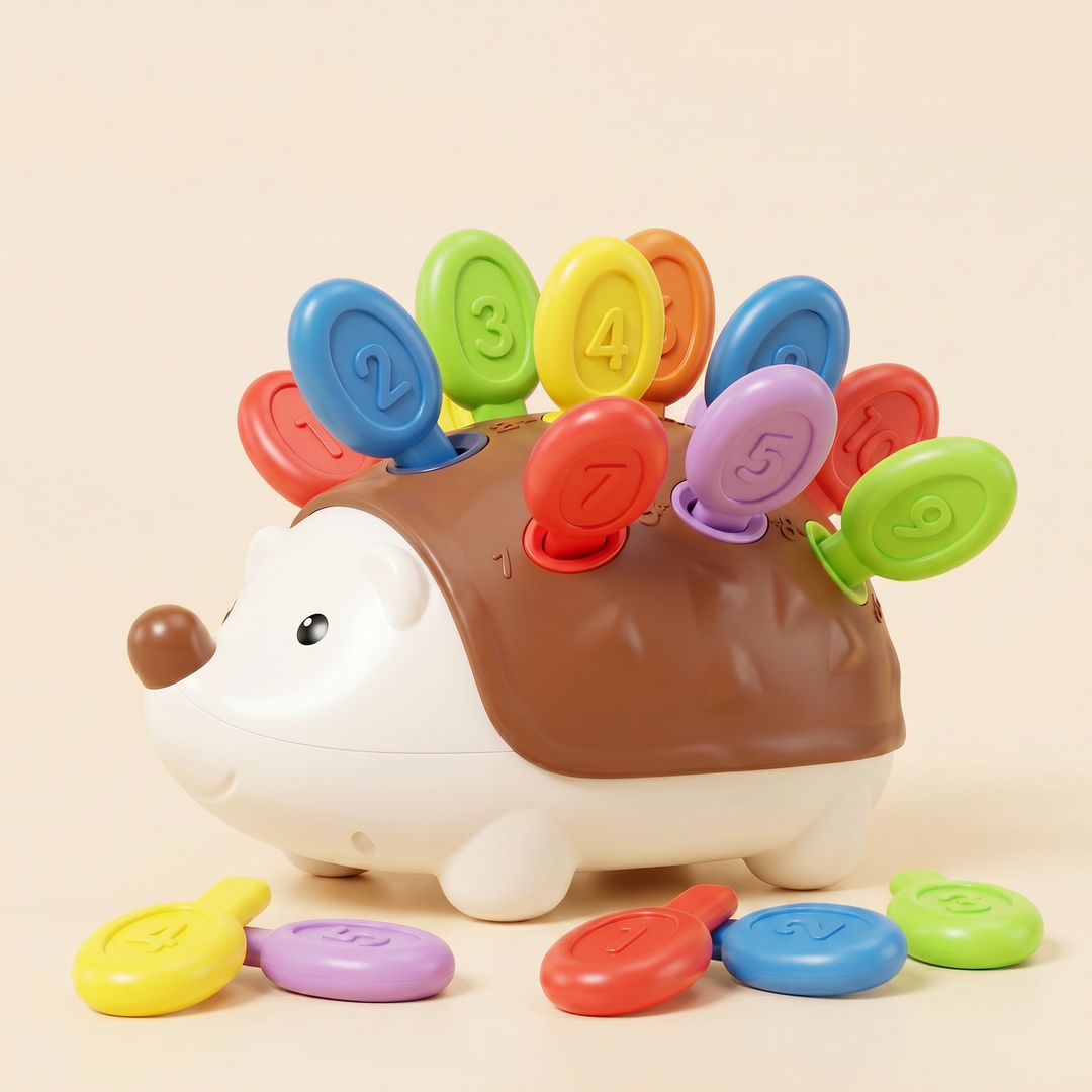 Counting hedgehog toy on warm cream - cream-and-brown plastic body with colored numbered pegs as quills and loose pegs