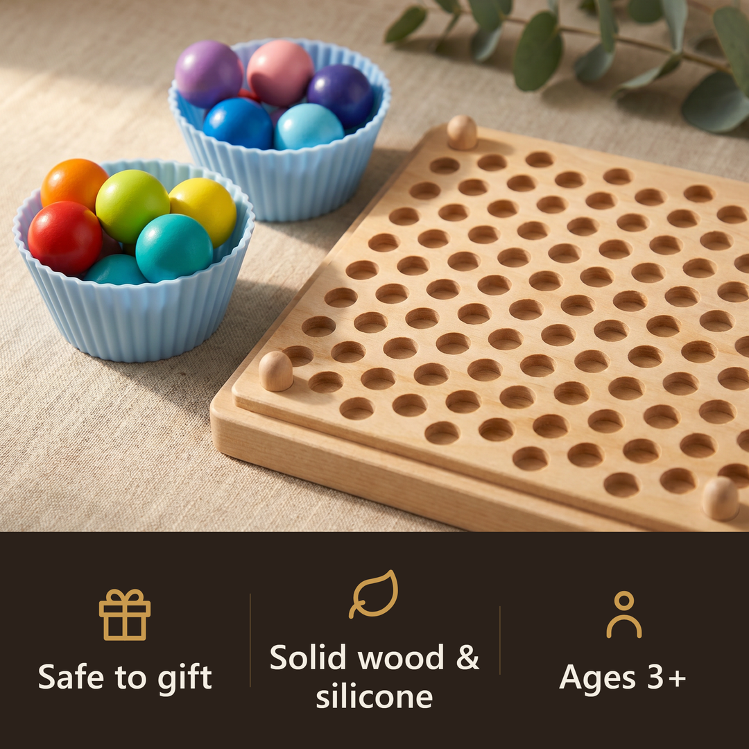 The solid-wood rainbow bead pegboard and cups of colorful beads on linen with a eucalyptus sprig. Badges: safe to gift, solid wood and silicone, ages 3+.