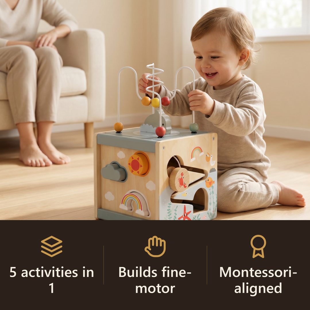 A toddler absorbed playing with the wooden 5-in-1 activity cube while a parent relaxes nearby - one toy, calm room. Badges: 5 activities in 1, builds fine-motor, Montessori-aligned.