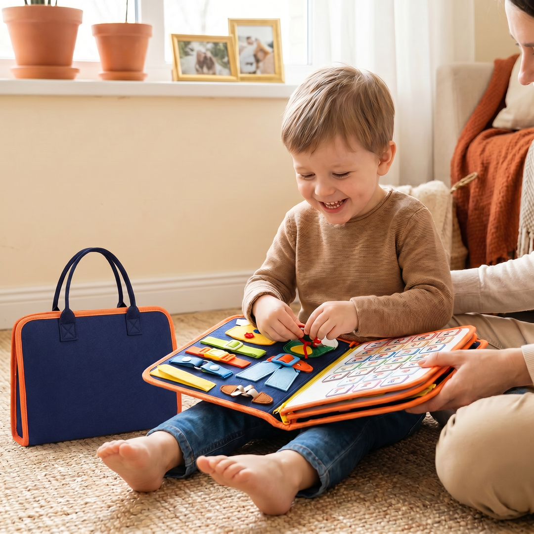 A young child sitting with the felt quiet book open across their lap, fastening a buckle