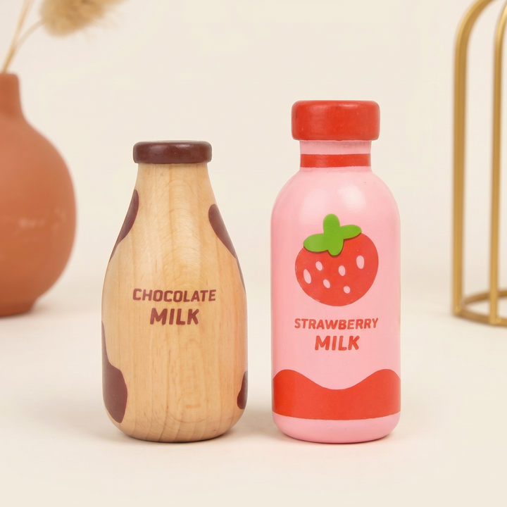 Close-up of the wooden chocolate milk and strawberry milk bottles