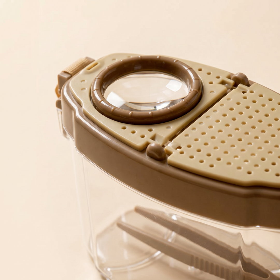 Close-up of the magnifier lens and ventilation holes on the tan-brown lid