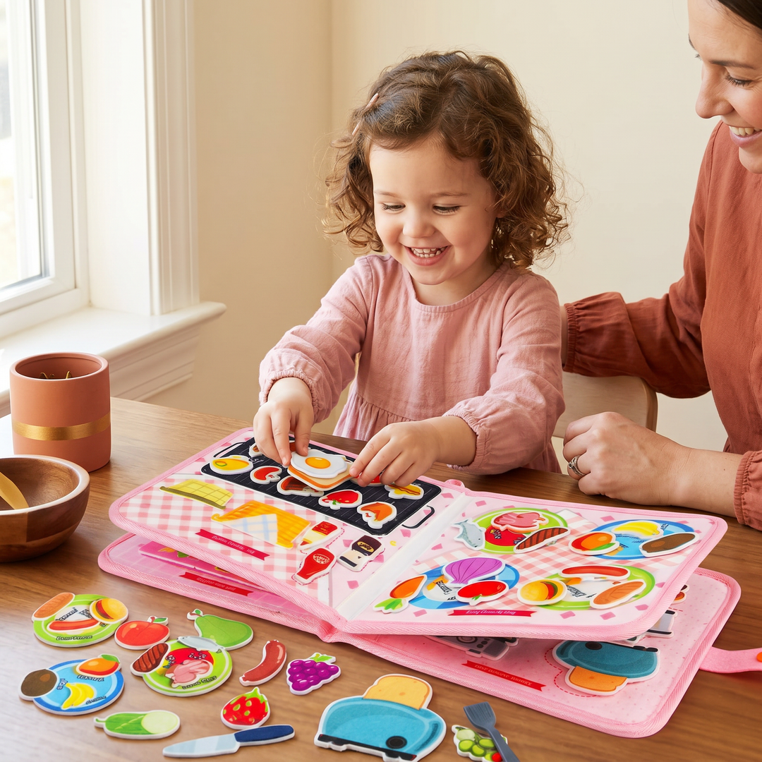A young child playing with the open cloth cooking busy book, placing a felt food piece