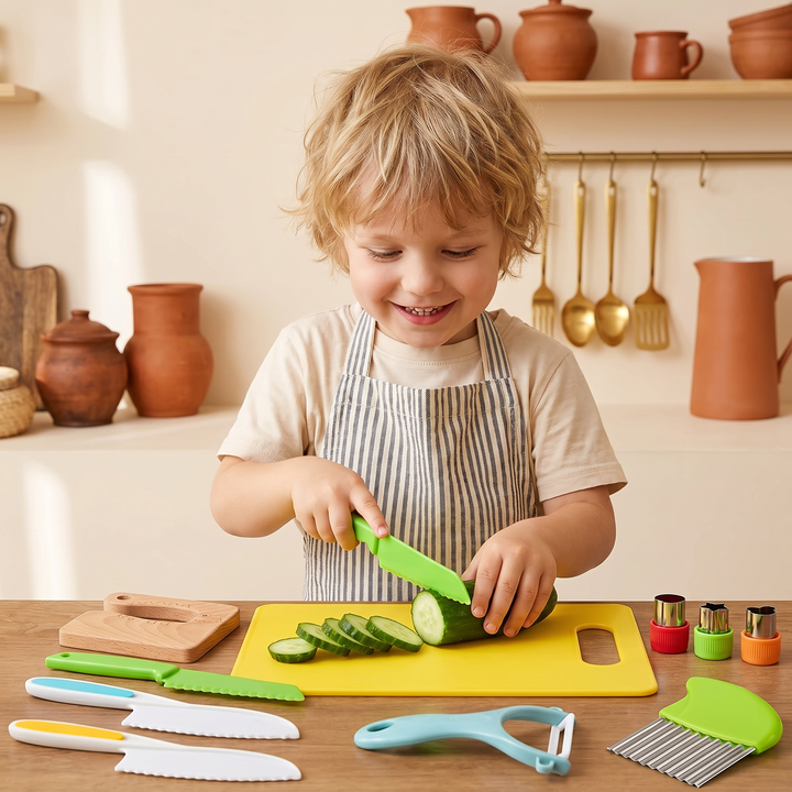 A young child in an apron carefully slicing soft cucumber with a kid-safe knife