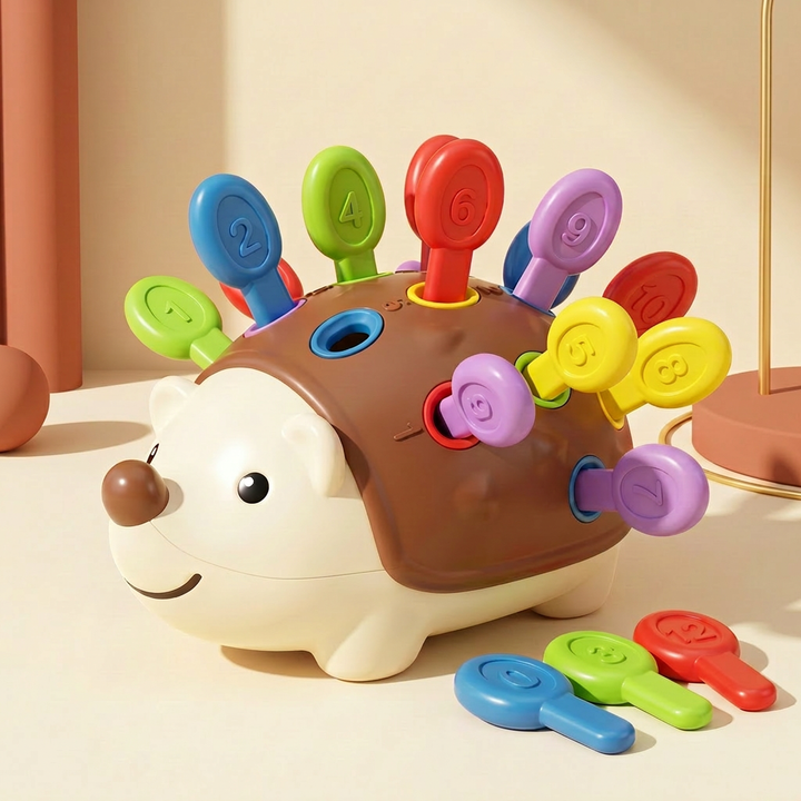 Assembled counting hedgehog with colored numbered pegs and a few loose pegs beside it