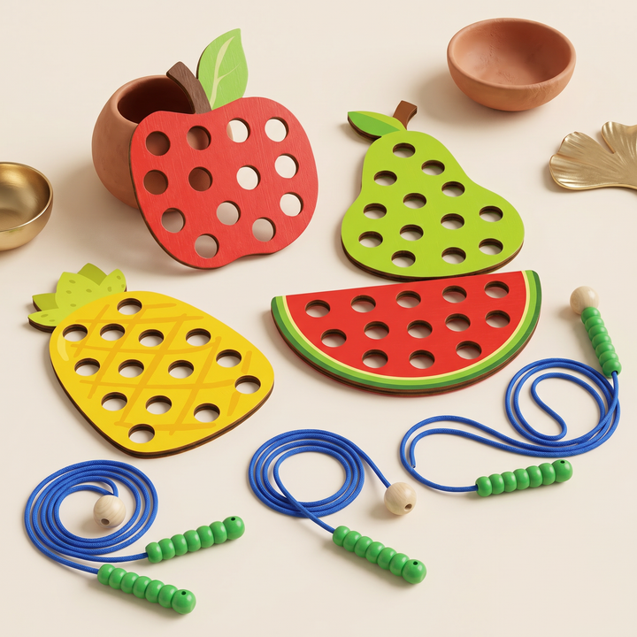 The four wooden fruit lacing boards arranged together with the green worm laces