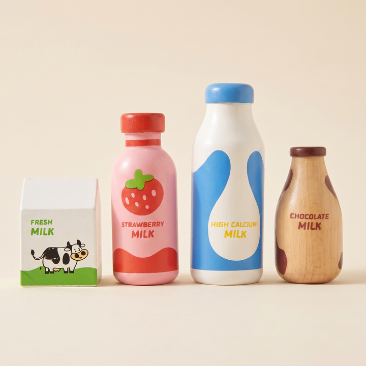 The four wooden milk pieces standing together on warm cream