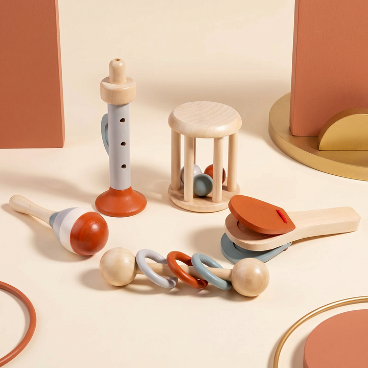The full wooden baby music set arranged together on warm cream