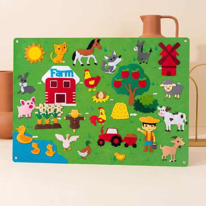Felt farm story board fully arranged with barn, animals, tractor, windmill and farmer