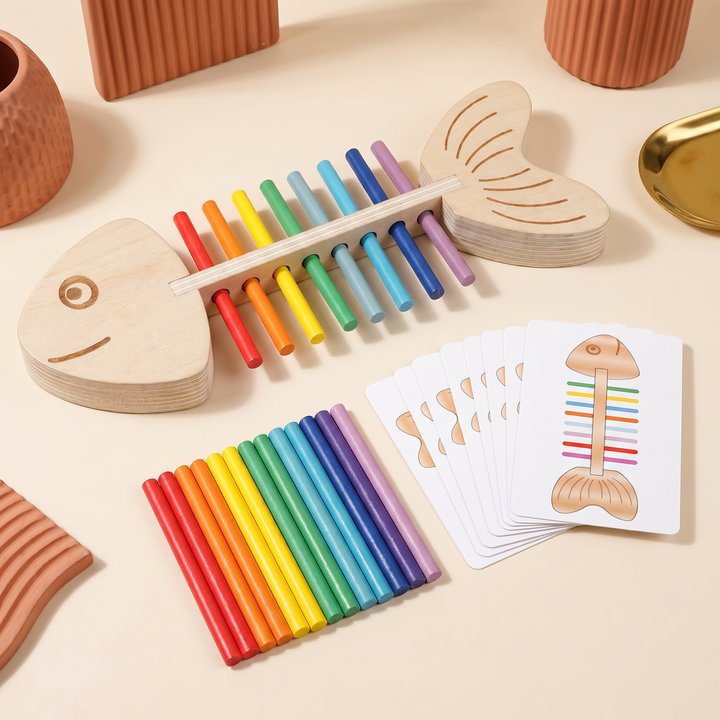 The full wooden fish peg set laid out - frame, rainbow sticks and double-sided pattern cards