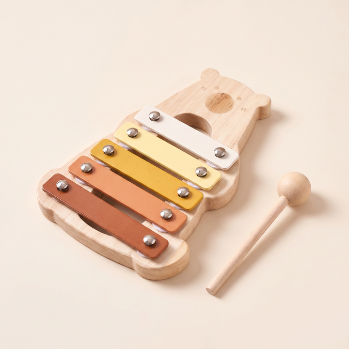 Bear-shaped beechwood xylophone with five colour bars and the wooden mallet beside it
