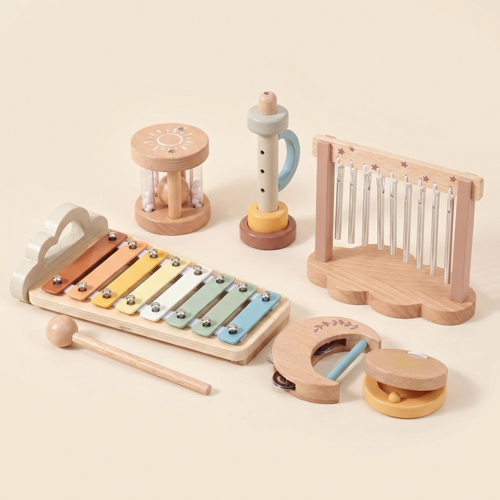 The full wooden baby music set arranged together on warm cream