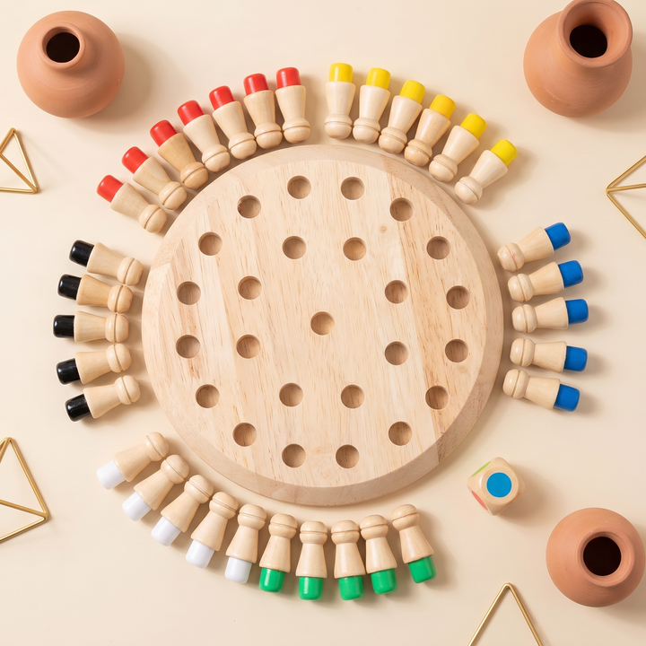 Top-down of the round memory board with pegs grouped by color and the color die